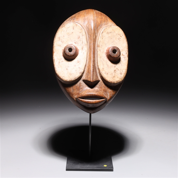 Appraisal: West African carved wooden Kwele mask with custom wood stand