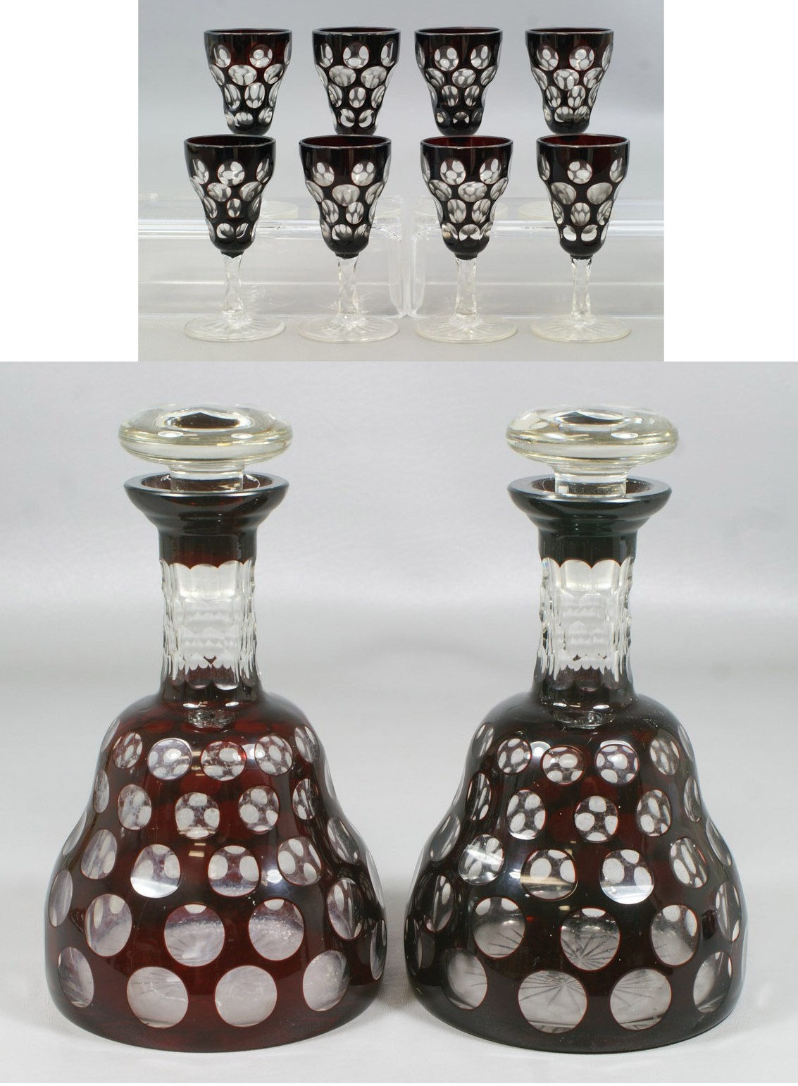 Appraisal: Pr ruby cut to clear thumb print pattern decanters with