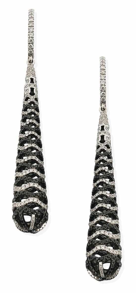 Appraisal: A PAIR OF BLACK AND WHITE DIAMOND EARRINGS Each elongated