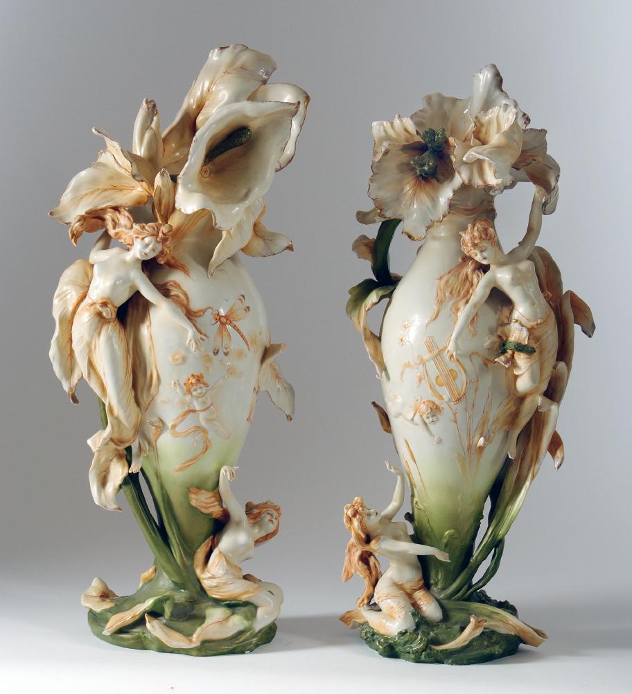 Appraisal: A PAIR OF RUDOLSTADT VOLKSTEDT ART NOUVEAU PORCELAIN FIGURAL VASES