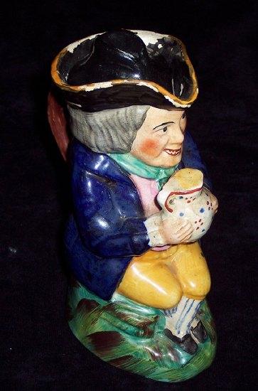 Appraisal: An early th Century Toby jug the figure with open