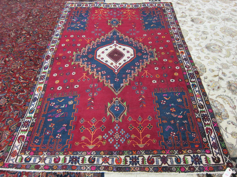 Appraisal: PERSIAN SHIRAZ CARPET Fars Province southwestern Iran central geometric lozenge