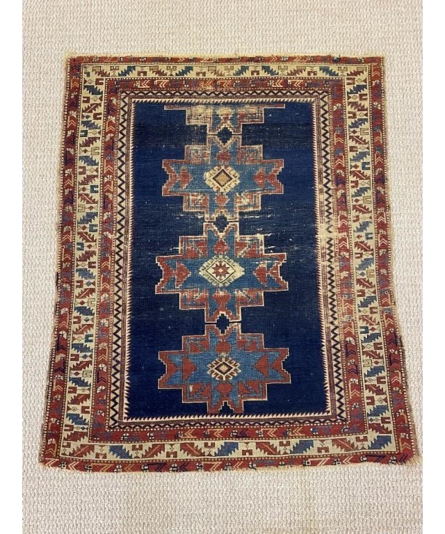 Appraisal: Antique Caucasian mat with geometric center medallions on a blue