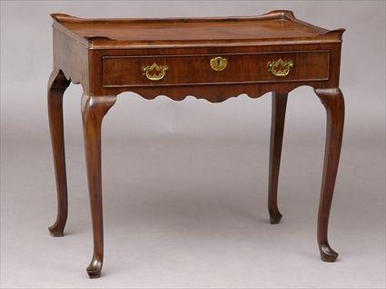 Appraisal: GEORGE II MAHOGANY SIDE TABLE The solid mahogany top with