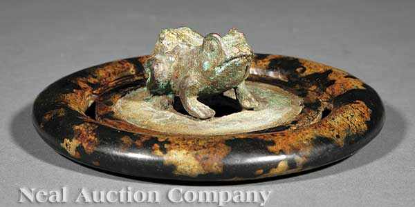 Appraisal: A Chinese Bronze Bi Disc Surmounted by a Crouching Toad