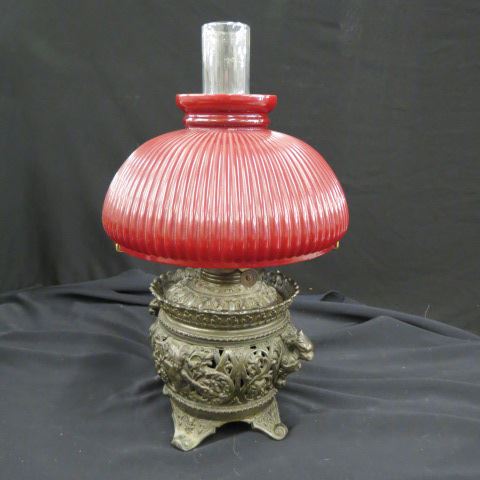 Appraisal: Victorian Cast Iron Oil Lamp fancy opework box red shade