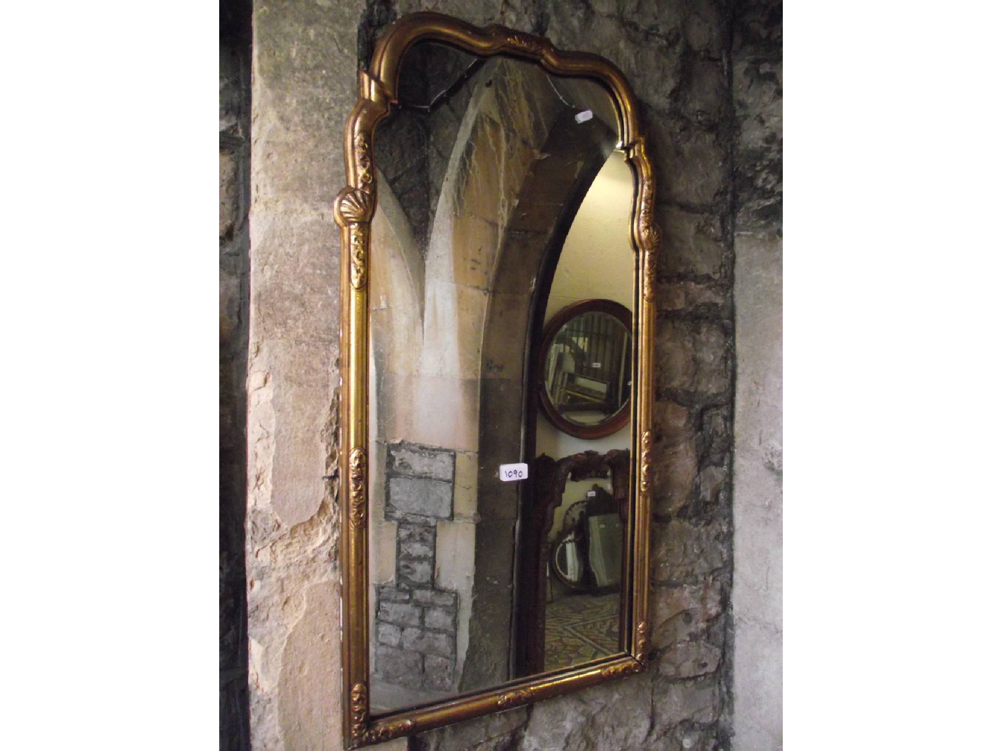 Appraisal: A Georgian style gilt framed wall mirror the stepped arched