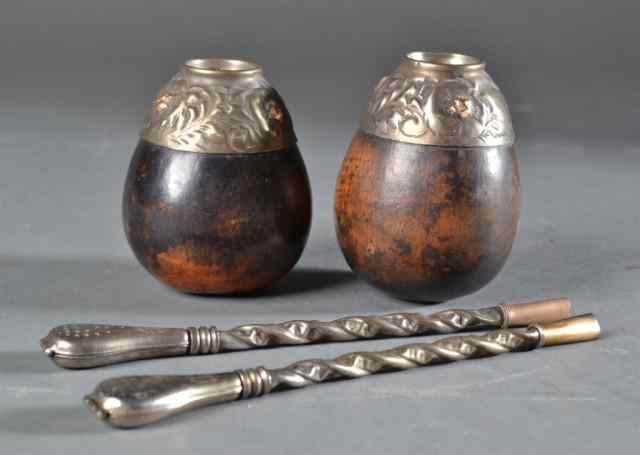 Appraisal: Argentinian Silvered Decorative ArtsTo include two bombillas with twisted shaft