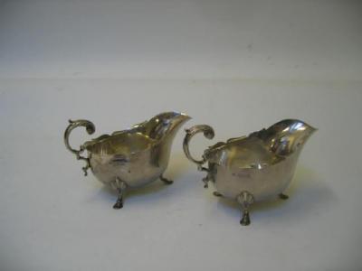 Appraisal: A PAIR OF EDWARDIAN GRAVY BOATS Henry Stratford London with