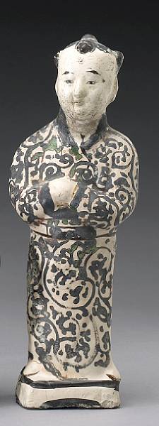 Appraisal: A Cizhou style slip glazed pottery figure of a boy