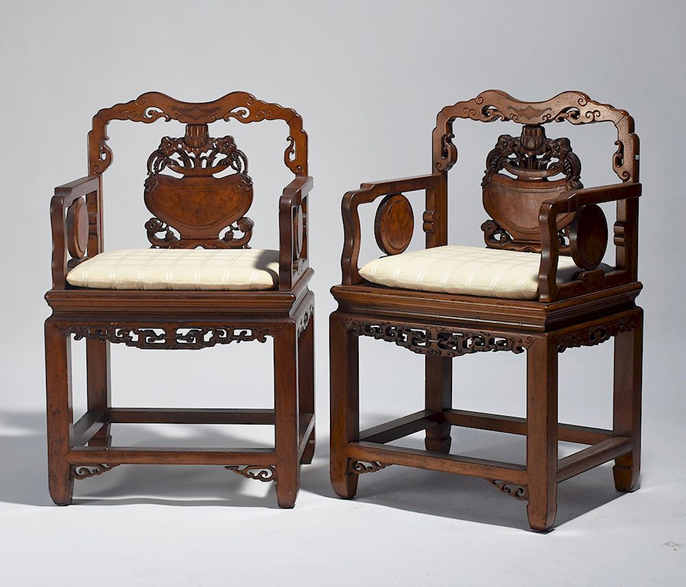 Appraisal: Pair Chinese carved armchairs in kingwood Pair Chinese carved armchairs