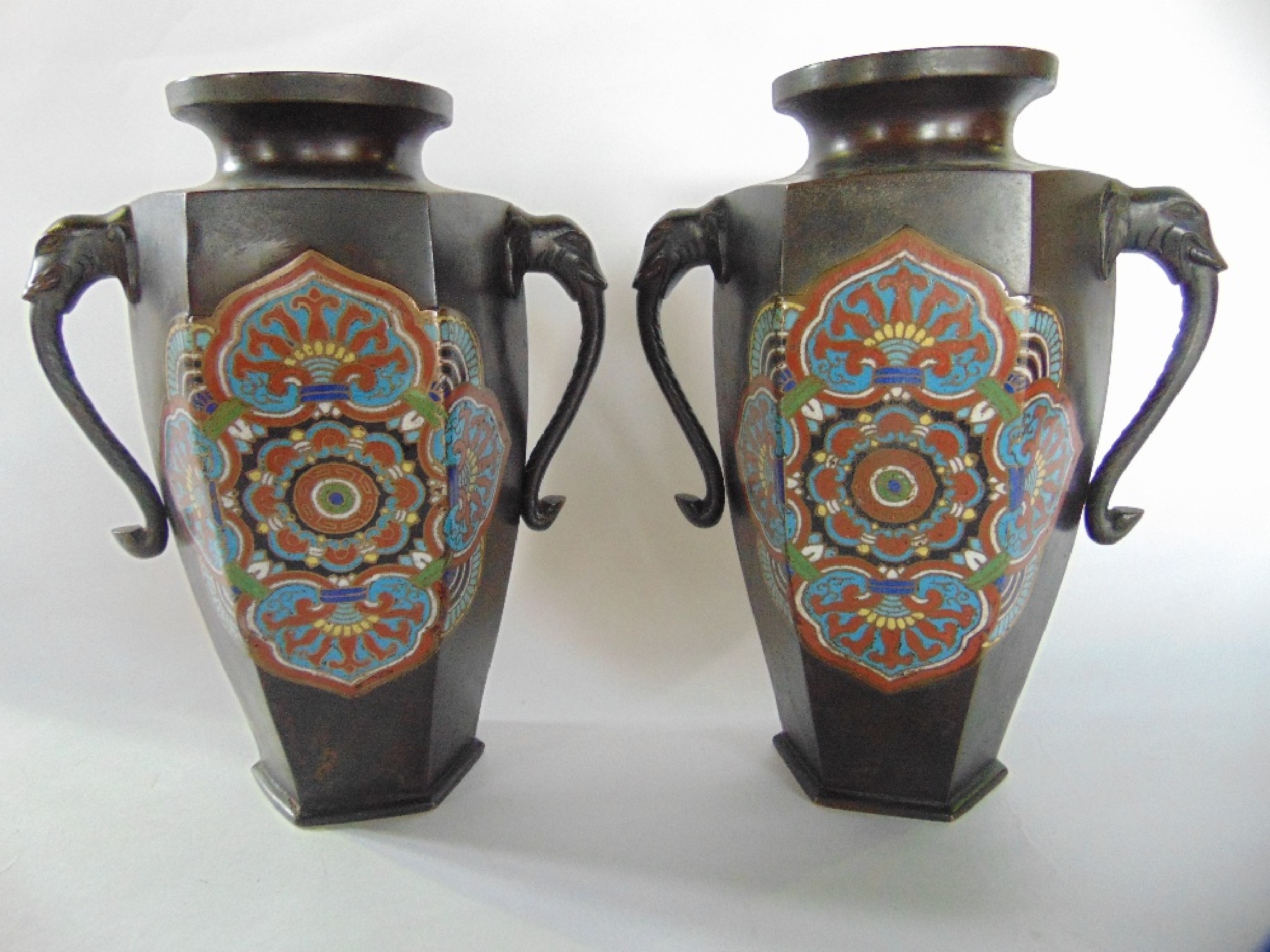 Appraisal: A pair of bronze vases of hexagonal form with central