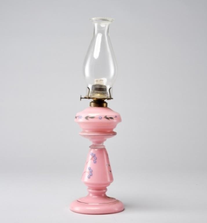 Appraisal: ANTIQUE PINK OIL LAMPAn antique oil lamp in hand-blown pink