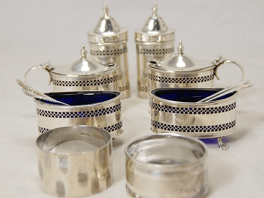 Appraisal: Oval silver six-piece pierced condiment set comprising two mustards two