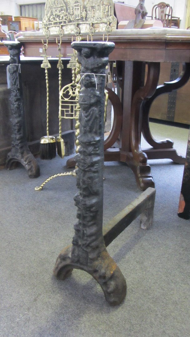 Appraisal: A pair of English cast-iron andirons of Elizabethan style th