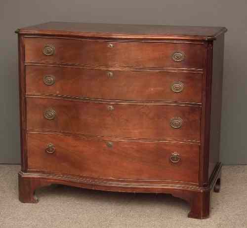 Appraisal: A mahogany serpentine front chest of drawers of Georgian design