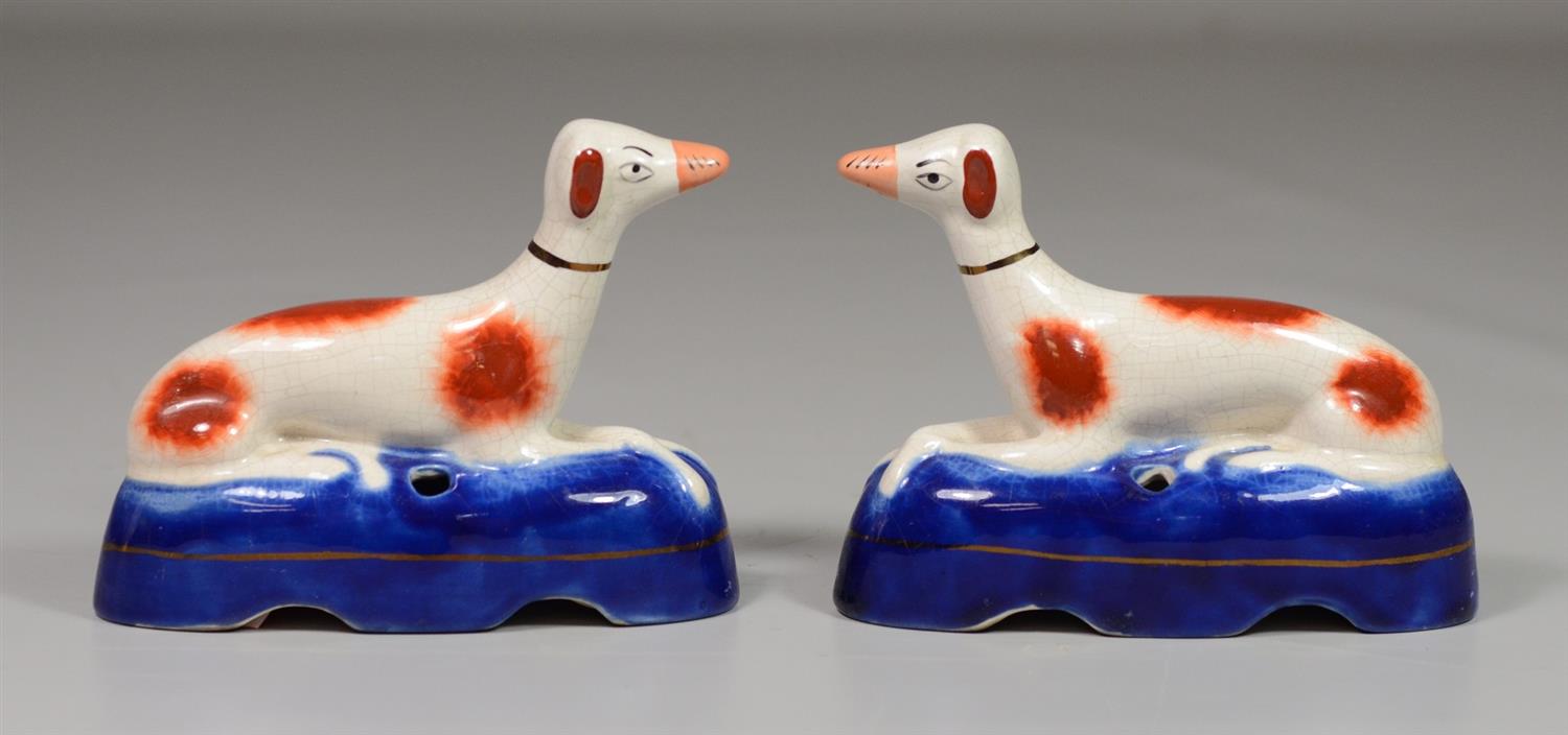 Appraisal: Pair Staffordshire reclining greyhound inkwells l h