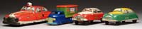 Appraisal: LOT OF FOUR TIN VEHICLES Marx Fire Department Chief Car