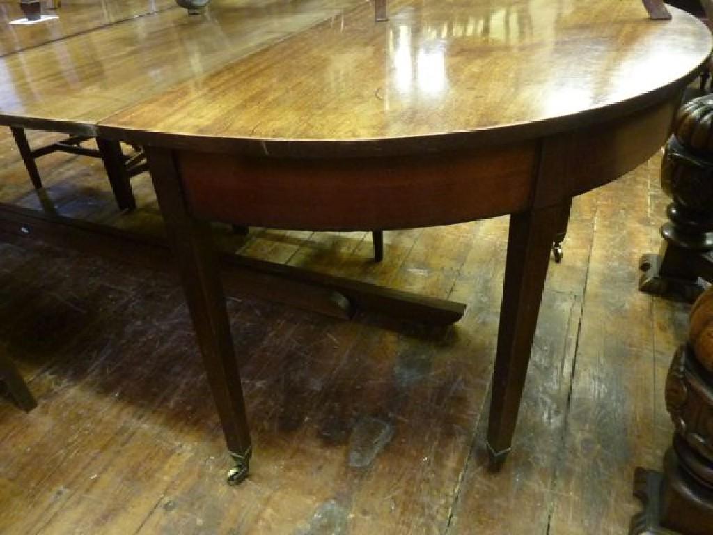 Appraisal: A Georgian mahogany D end extending dining table with three