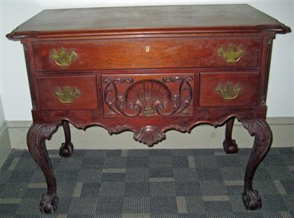 Appraisal: Chippendale-style carved mahogany dressing table late th century The shaped