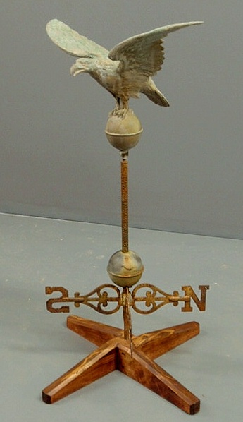 Appraisal: Molded zinc flying eagle weathervane with cast iron directionals wing