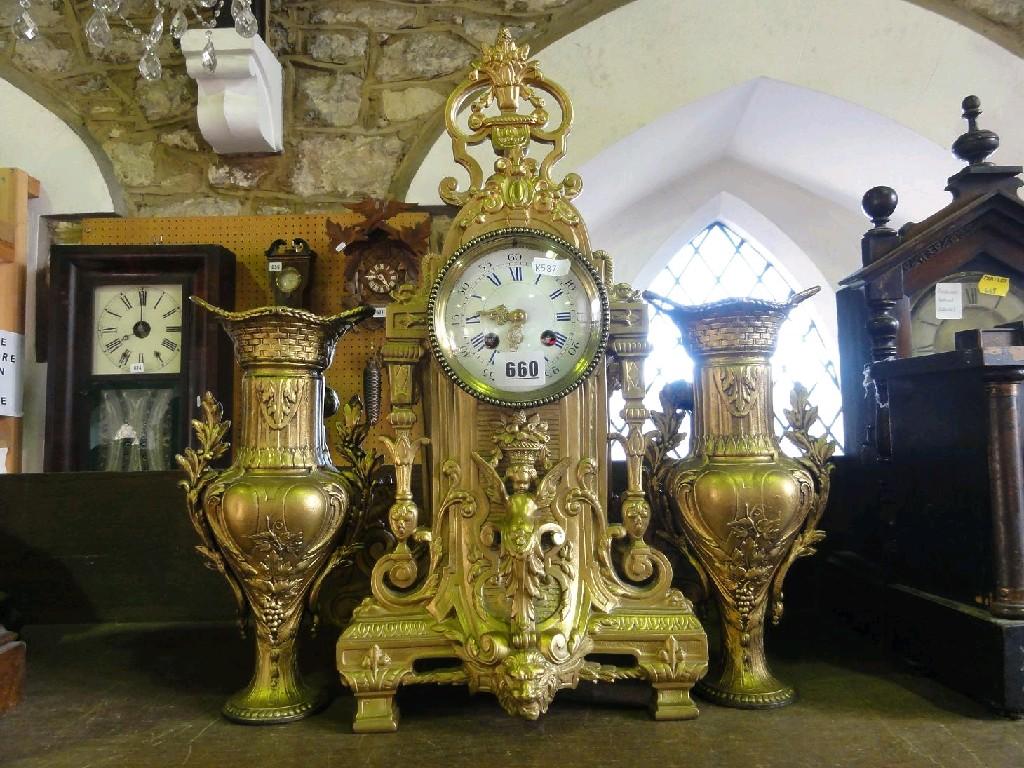 Appraisal: A late th century French gilded clock garniture in the