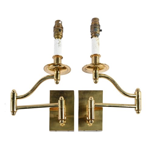 Appraisal: A pair of brass swing-arm wall lights late th c