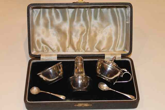 Appraisal: A SILVER THREE PIECE CONDIMENT SET comprising a pepper pot