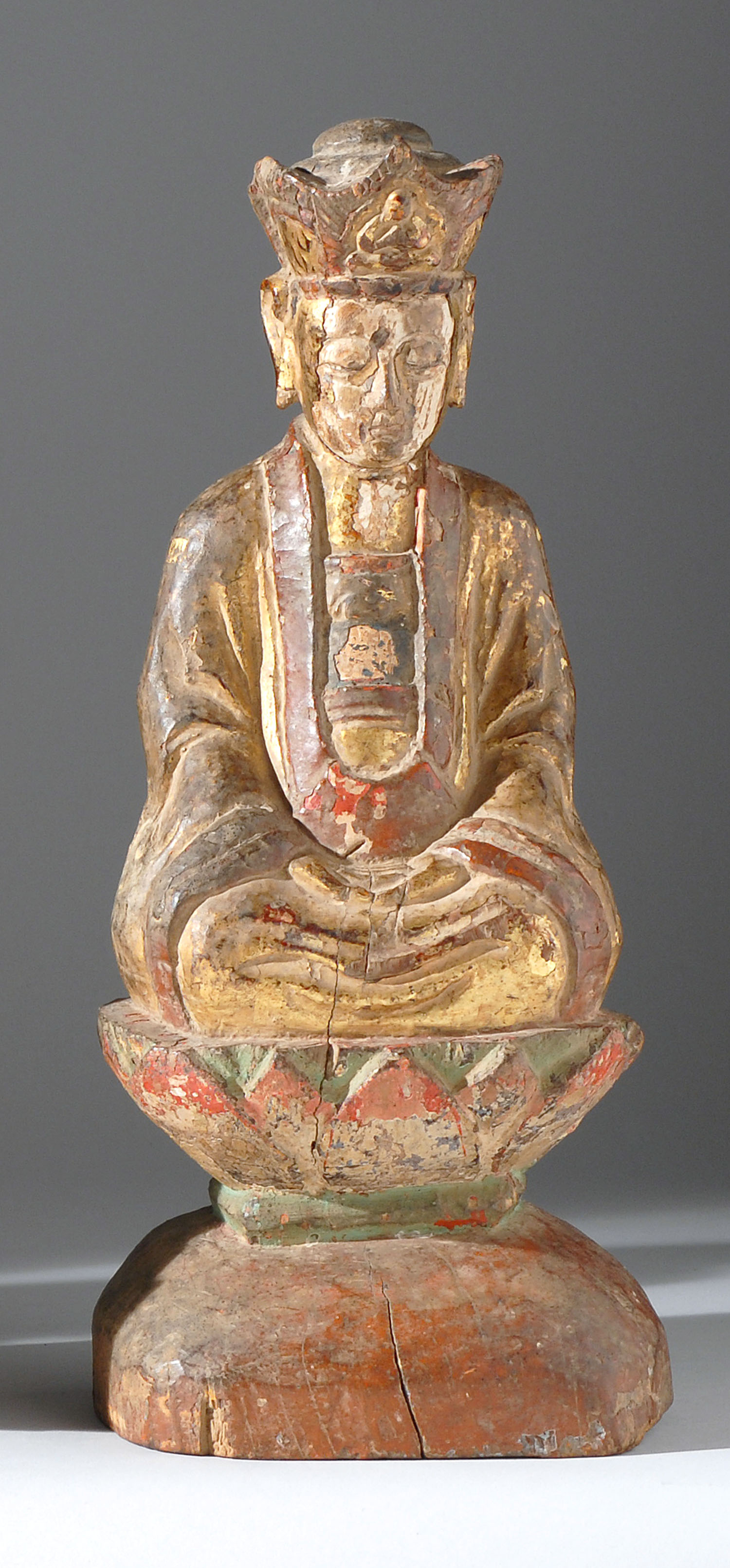 Appraisal: POLYCHROME AND GILTWOOD FIGURE OF BUDDHA th th CenturySeated in