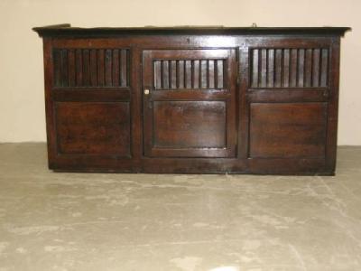 Appraisal: AN OAK HANGING FOOD CUPBOARD with moulded cornice central door