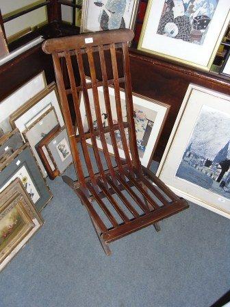 Appraisal: A MAHOGANY FOLDING STEAMER CHAIR