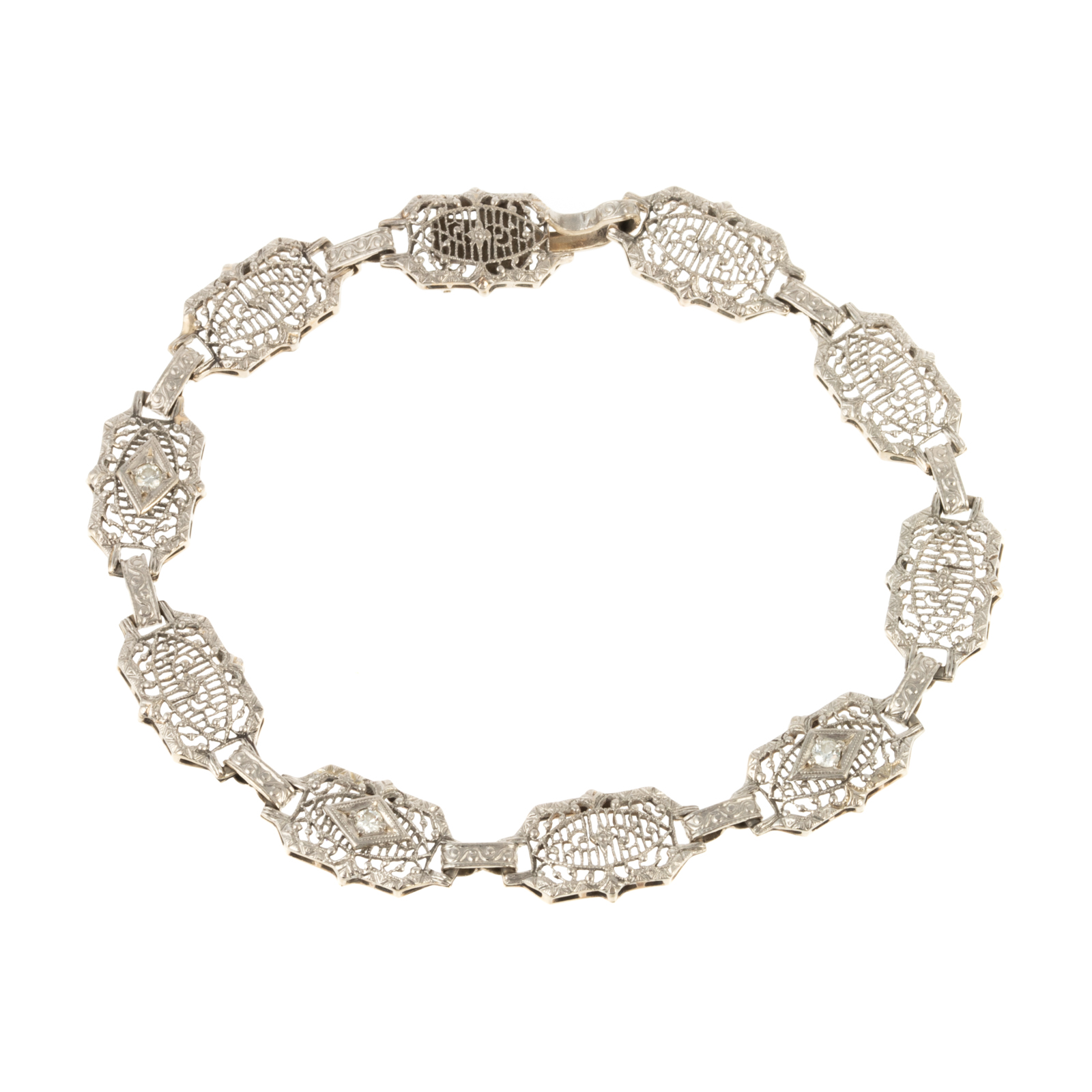 Appraisal: A DIAMOND FILIGREE LINK BRACELET IN K K white gold