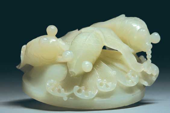 Appraisal: WHITE JADE FISH COVER Charming and well carved Chinese white