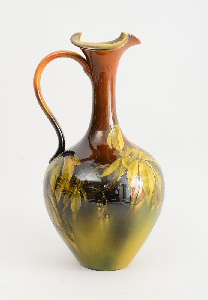 Appraisal: ROOKWOOD STANDARD GLAZE POTTERY EWER Impressed logo with five rays