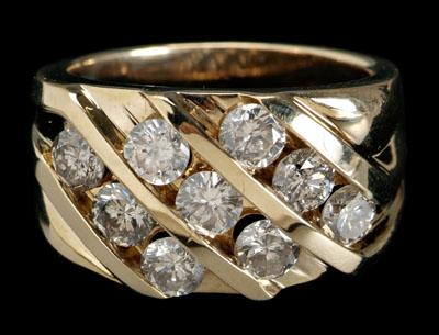 Appraisal: Gent's diamond gold ring nine channel-set round brilliant-cut diamonds total