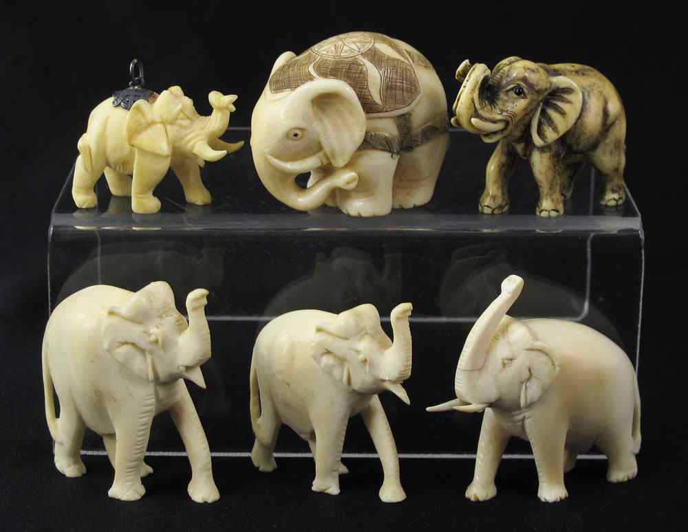 Appraisal: PIECE CARVED IVORY NETSUKE OKIMONO All in the form of