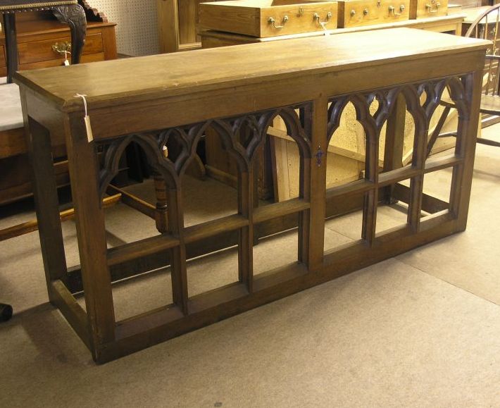 Appraisal: A solid oak church table carved with gothic arched open