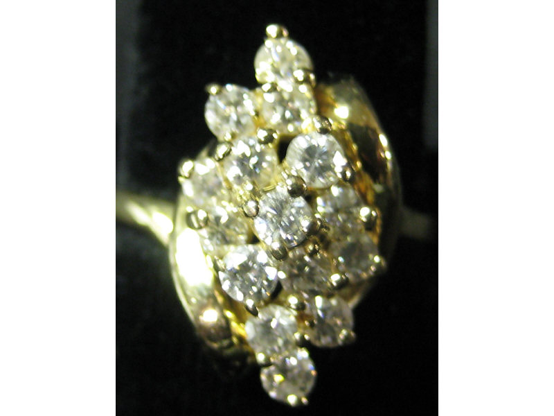 Appraisal: DIAMOND CLUSTER RING k yellow gold lady's ring set with