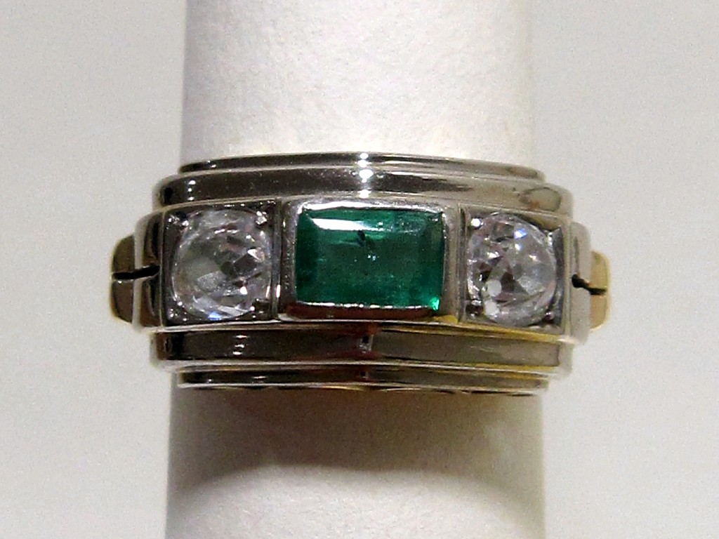 Appraisal: Art Deco bi colour gold emerald and diamond three stone