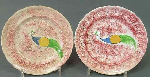 Appraisal: Two peafowl red spatterware plates early th c dia