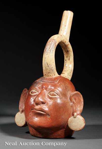 Appraisal: A Pre-Columbian Pottery Stirrup Spout Portrait Vessel head-form body molded