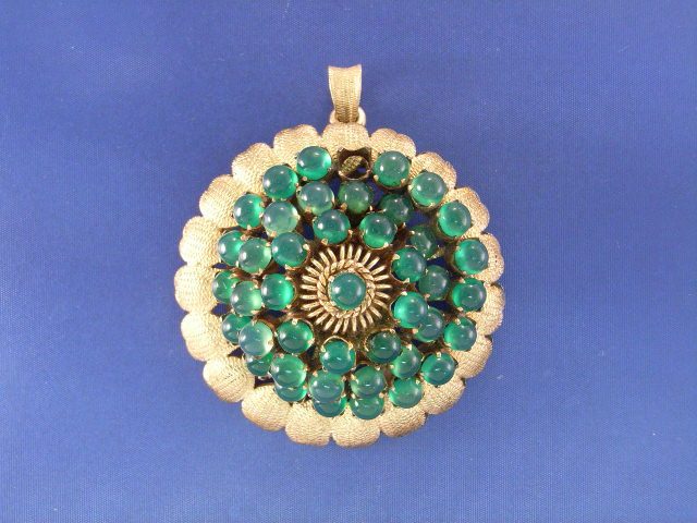 Appraisal: A ct gold cabochon emerald cluster brooch one stone deficient