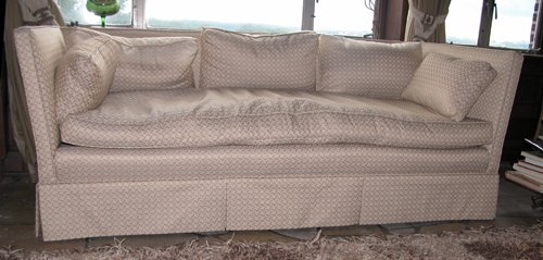 Appraisal: Title Sofa with beige upholstery and pillows Medium upholstered sofa