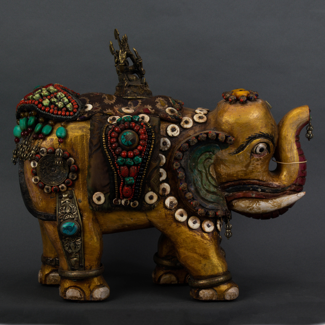 Appraisal: HIMALAYAN GEMSTONE DECORATED ELEPHANT WITH BRONZE STATUE OF GANESH Himalayan