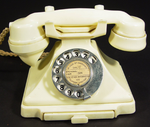 Appraisal: Ivory bakelite pyramid dial telephone with chrome dial and drawer