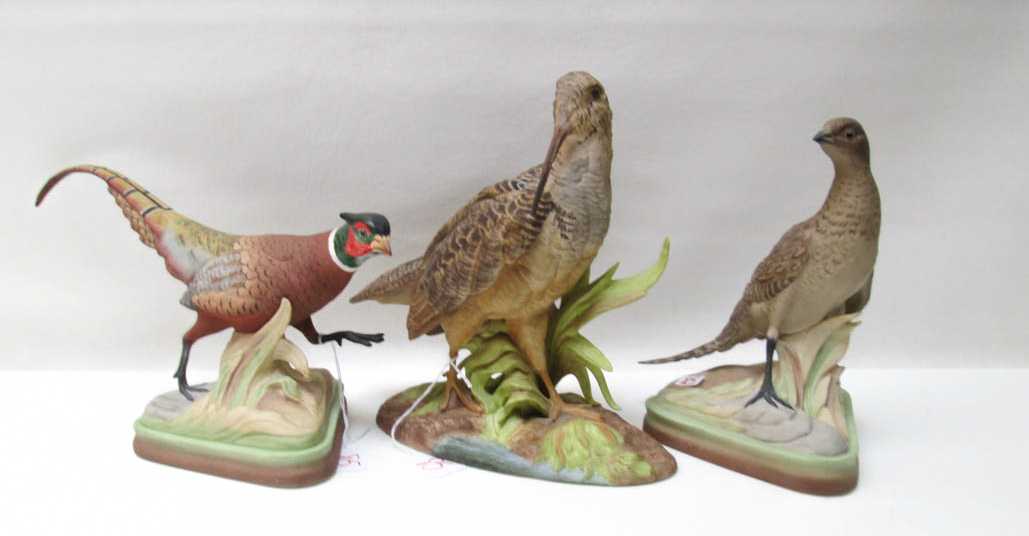 Appraisal: THREE BOEHM BISQUE BIRD SCULPTURES pair of Ring-necked Pheasants together