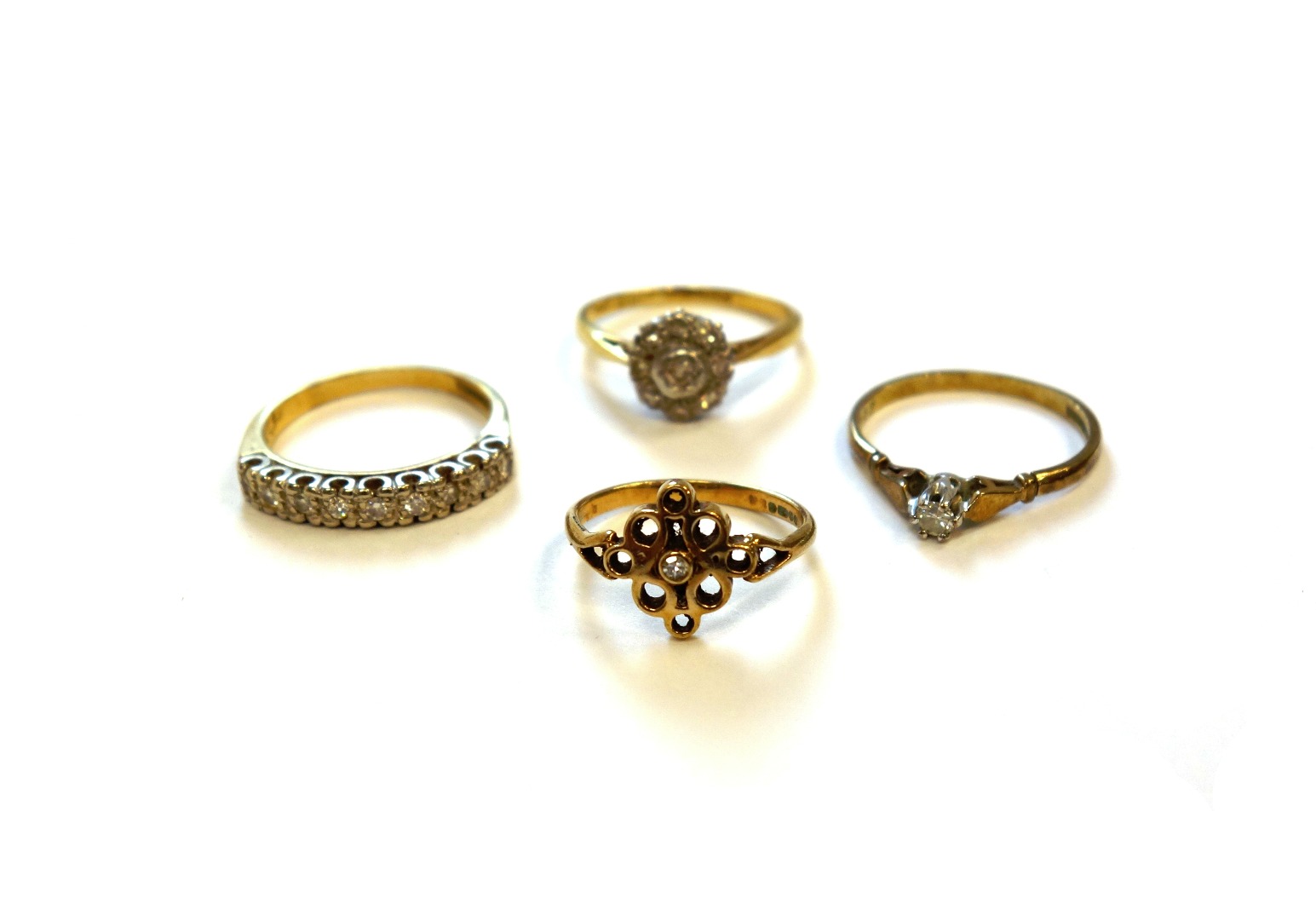 Appraisal: A gold and platinum diamond set nine stone cluster ring