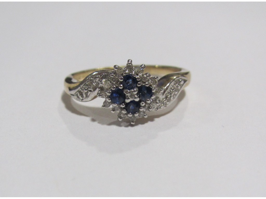 Appraisal: Nine carat gold sapphire and diamond cluster ring