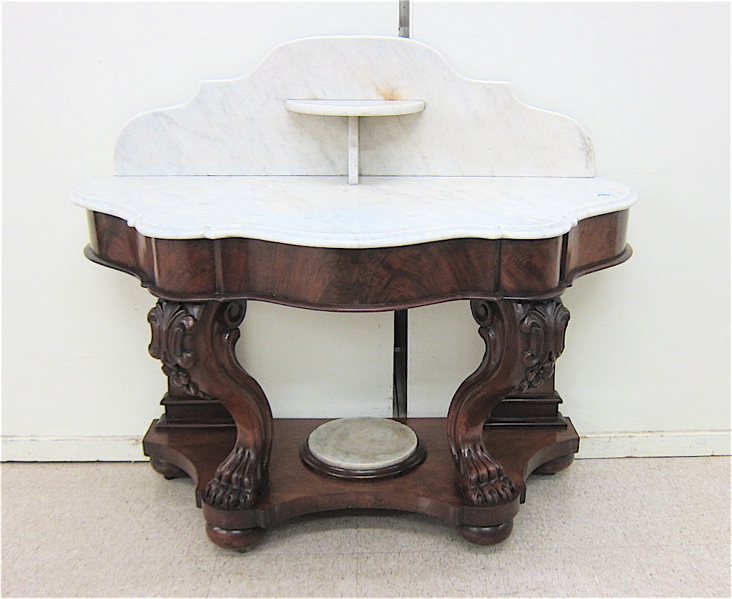 Appraisal: VICTORIAN MARBLE TOP MAHOGANY WASHSTAND English th century a demilune