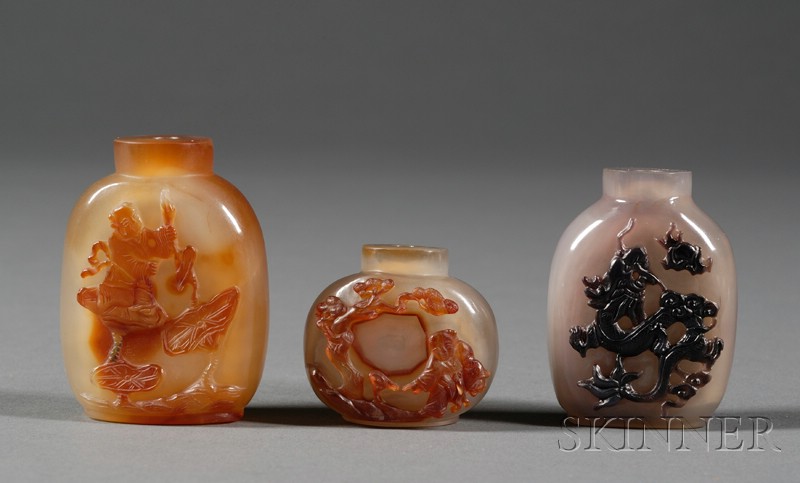 Appraisal: Three Shadow Agate Snuff Bottles surfaces carved with a dragon